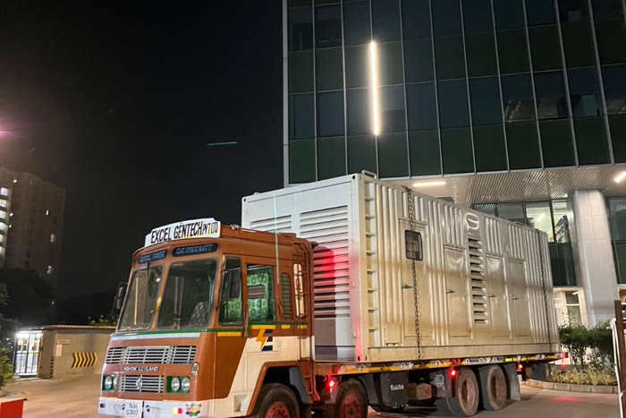 Excel Gentech generator delivered to a modern IT corporate campus at night